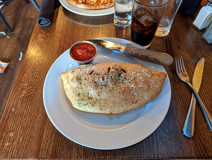 Half-moon of happiness: this calzone is bursting with cheesy potential. Folded pizza never looked so good!