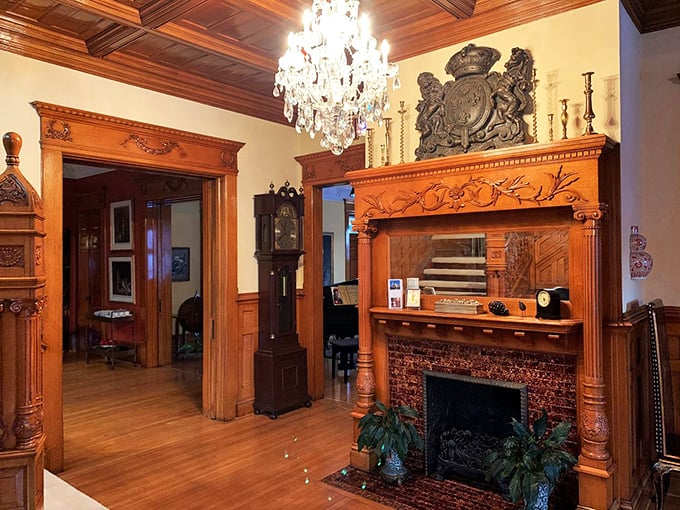 If these walls could talk... they'd probably brag about this stunning fireplace. Wood paneling and intricate carvings make this a true showstopper.