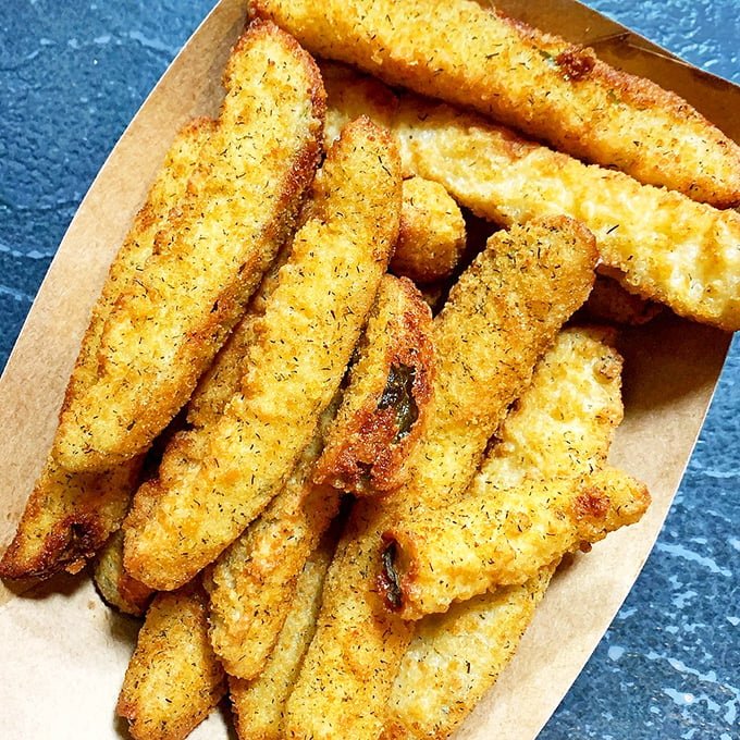 Golden, crispy, and utterly irresistible. These fried pickles aren't just a side dish; they're a lifestyle choice that'll have you plotting your next visit.