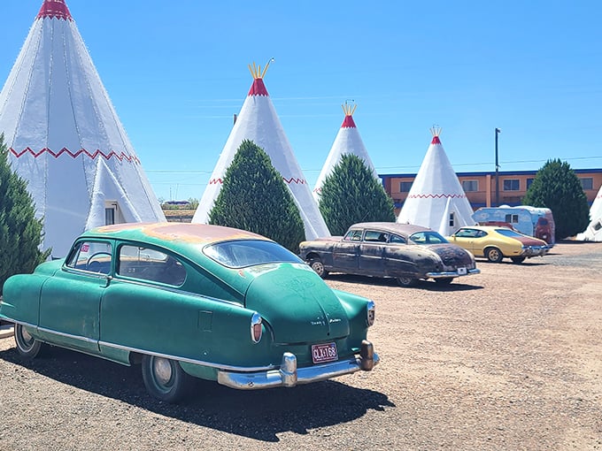 Roadside Americana at its finest! The Wigwam Motel's vintage cars and cozy cones are like "American Graffiti" meets "Close Encounters of the Third Kind."