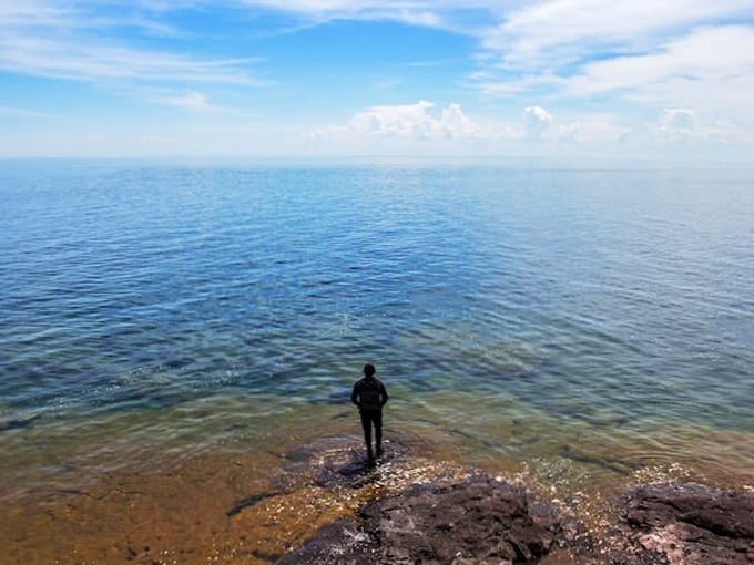 Contemplating life's big questions... or just admiring the view? Either way, this spot's perfect for some deep-water thinking.