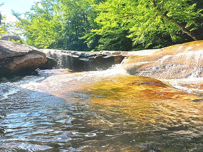 Smooth rocks and crystal-clear waters invite adventure. This hidden gem in Newry is Mother Nature's own waterpark, minus the long lines.