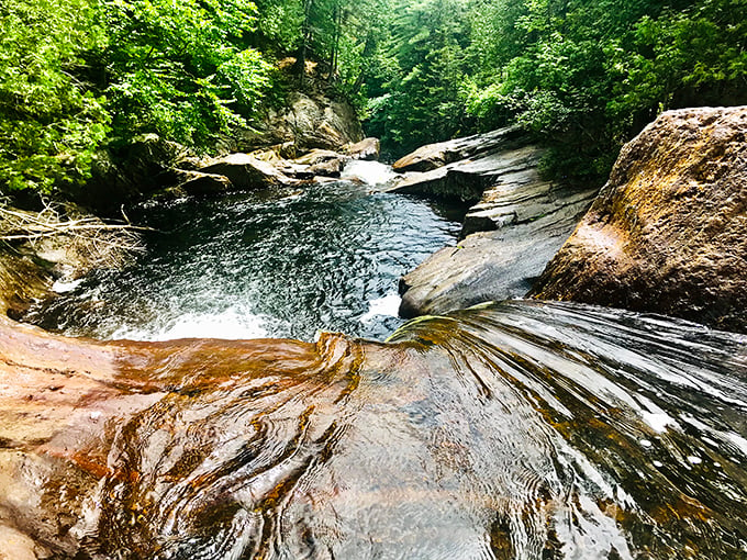 Golden rocks and cascading waters create a scene worthy of a fantasy novel. Is that a hobbit hiding behind that boulder?