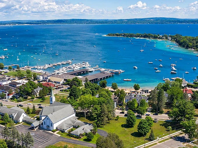 Nestled between green hills and blue waters, Harbor Springs is the cozy sweater of lakeside towns. Photo credit: Bay North Realty