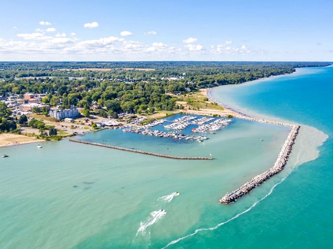 Lexington Harbor: Where boats gather like gossiping neighbors and the water whispers tales of adventure. Photo credit: Blue Water