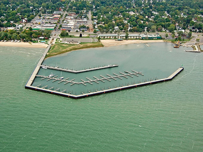 Tawas City: Where the pier stretches out like a welcoming arm and the water sparkles with possibility. Photo credit: Marinas