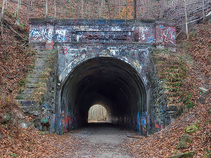 Spooky portal or time machine? This graffiti-covered tunnel entrance is like stepping into a Stephen King novel.