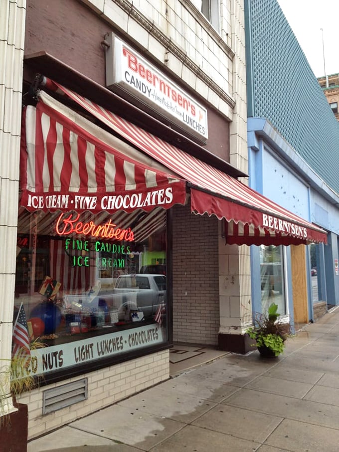 Neon dreams and sweet scenes. Beerntsen's classic signage beckons candy lovers to indulge in a slice of confectionery Americana.