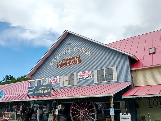 Welcome to the mothership of nostalgia! Vermont Antique Mall's blue facade and red roof scream 'Come in, we've got stories to tell!'