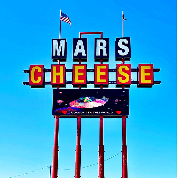 The sign says it all - you're about to enter a world that's truly out of this world. Prepare for liftoff, cheese astronauts! 