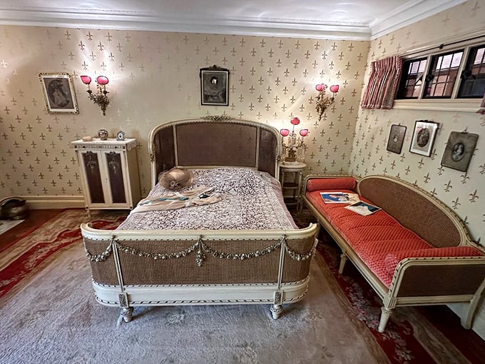 "Sweet dreams are made of this!" This elegant bedroom, with its ornate bed and floral wallpaper, promises a night's sleep fit for royalty (or at least a well-to-do rubber baron).