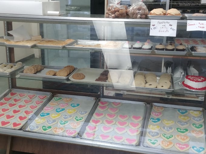 Behold, the Wall of Temptation! From heart-shaped cookies to towering cakes, this display case is where willpower comes to surrender. 