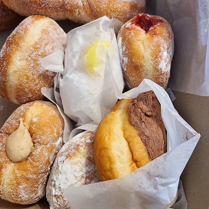 A box of joy, wrapped in paper! These pillowy delights are like edible clouds, each one a different flavor adventure waiting to happen.