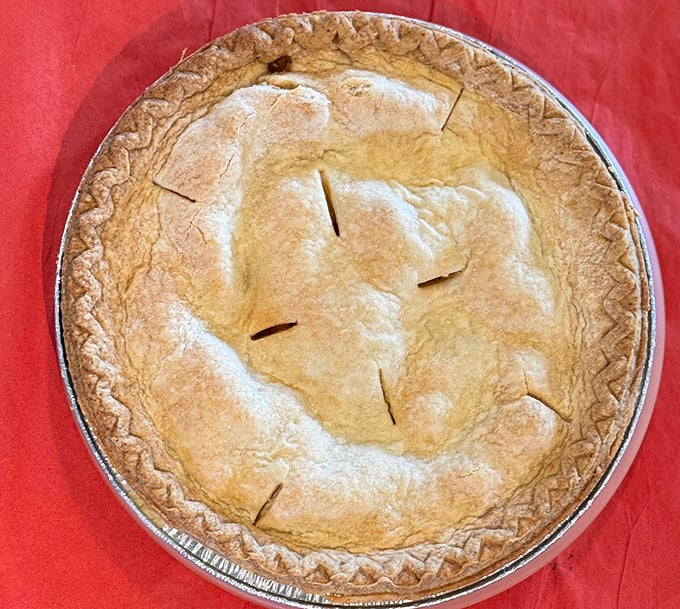 The Mona Lisa of pies. Golden, flaky, and mysterious – what secrets lie beneath that perfectly crimped crust? Only one way to find out!