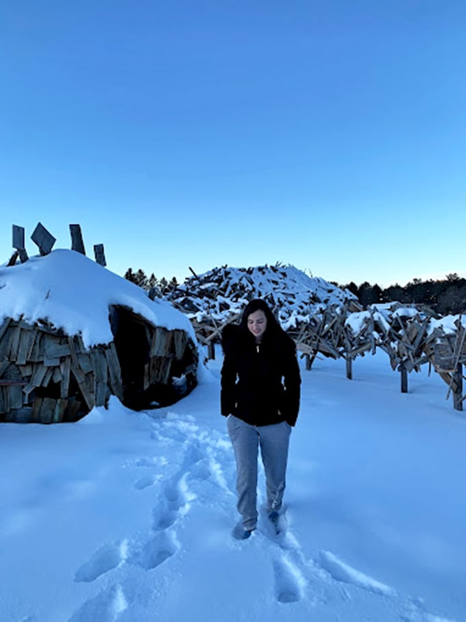 Snowshoes and wooden dinos - just another day in Vermont! This visitor's braving the cold for a prehistoric peek. Now that's dedication!