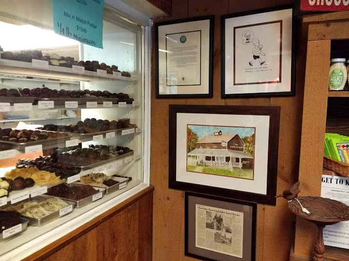 A sweet slice of history! The Chocolate Barn's wall of fame showcases its journey from humble beginnings to cocoa stardom. Who knew chocolate could be so photogenic?