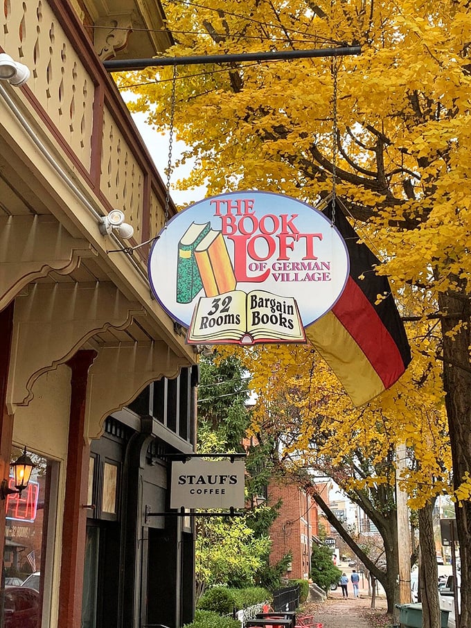 Fall in love with books all over again! The Book Loft's vintage sign, framed by golden leaves, promises 32 rooms of bargain-priced adventures.