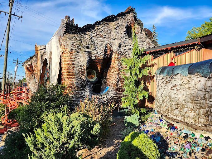 Nature meets nurture in this quirky garden. It's as if Dr. Seuss himself designed a landscape to complement this whimsical abode.