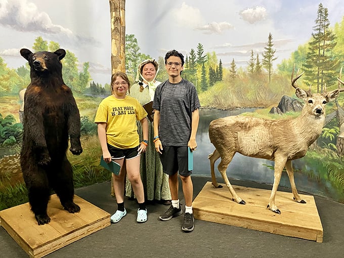 Who says you can't make new friends in a museum? These folks are getting up close and personal with some of Michigan's most stoic residents.