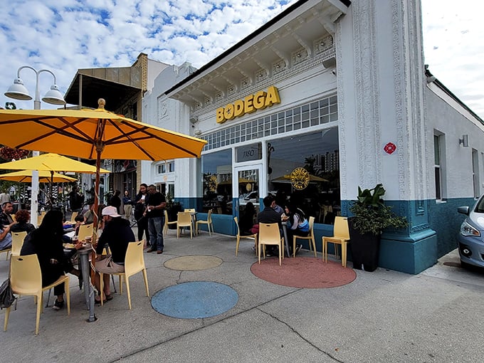 Bodega's outdoor seating: Where people-watching meets flavor explosion. Grab a Cuban and join the sidewalk fiesta!