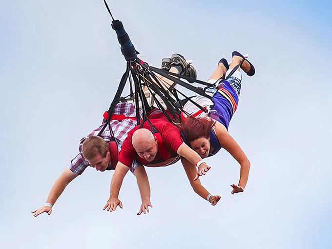 Three's company on this thrill ride. The SkyCoaster turns you and your friends into human pendulums.