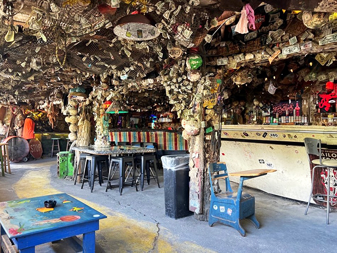 Dollar bills and license plates galore! Mahuffer's interior is like a hoarder's paradise meets Jimmy Buffett's garage sale.