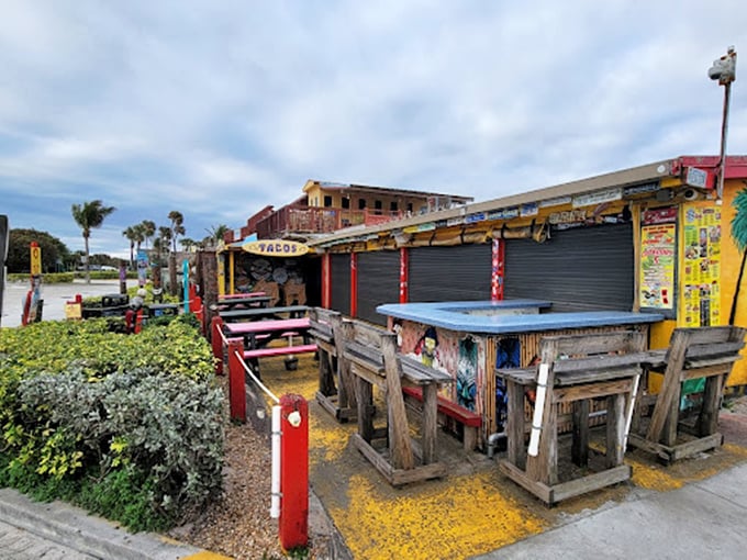 Surfboards overhead, sports on the screen. Sandbar's interior is like ESPN and a beach bum's Pinterest board had a wild night out.