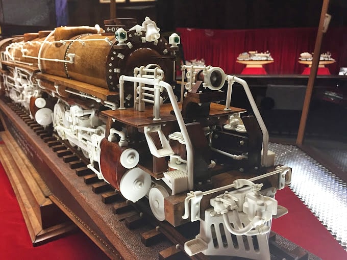 Choo-choose this stop on your journey! It's where the art of whittling meets the world of locomotives in a display of mind-boggling craftsmanship.