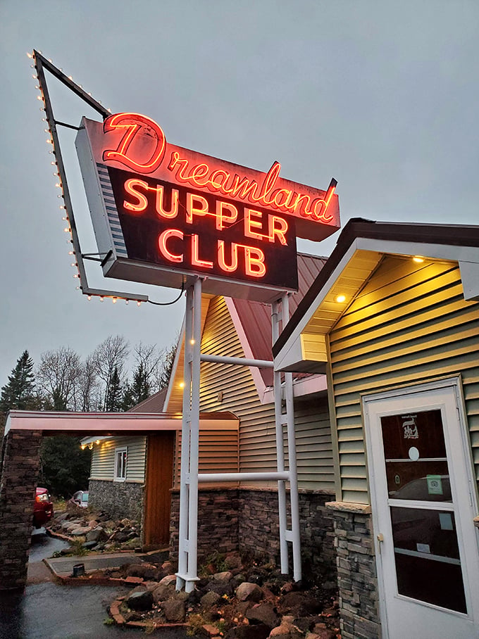 Dreamland's neon sign: a beacon of hope for hungry souls. It's like Vegas, but the jackpot is prime rib.