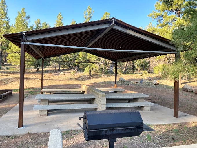 Nature's dining room awaits. This picnic area invites you to savor your meal with a side of fresh air and pine-scented breezes.