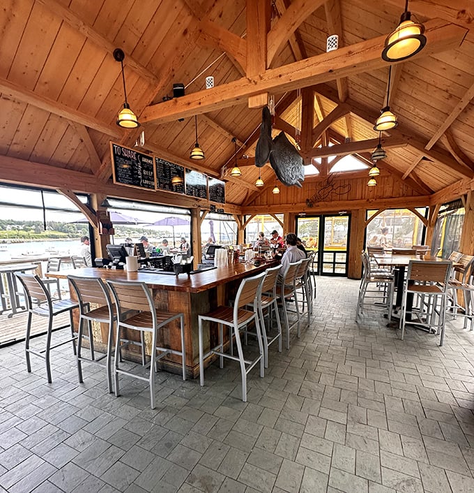 Step inside and you're greeted by a cathedral of seafood. The vaulted wooden ceiling and harbor views make you feel like you're dining in a luxurious ship's cabin.