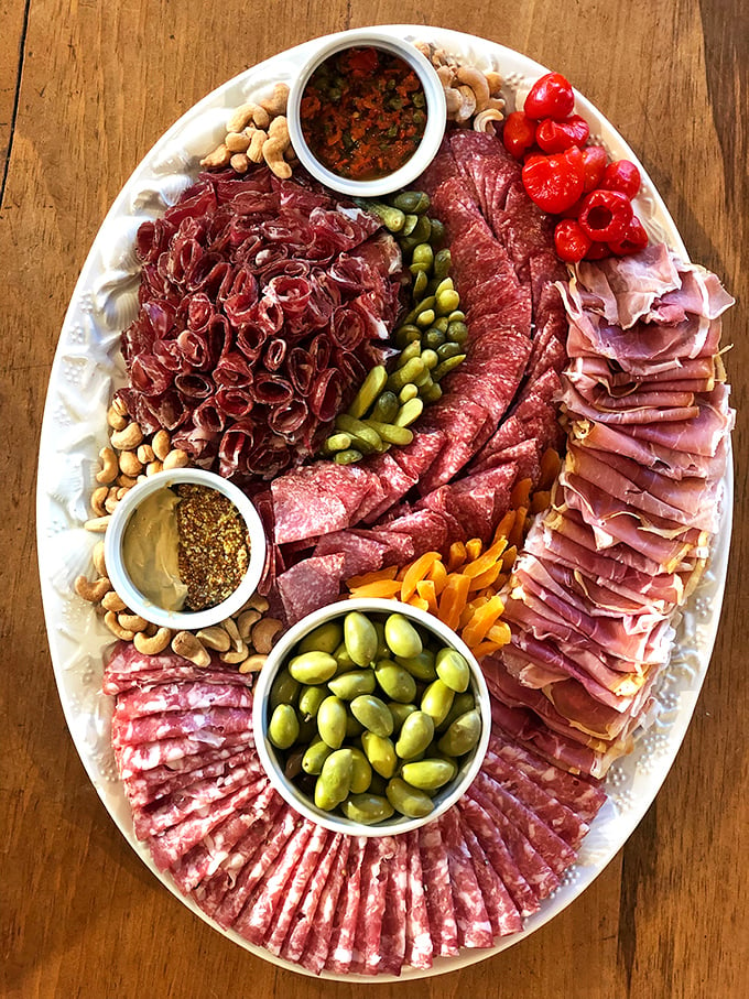 Meat and greet! This charcuterie board is a carnivore's carnival, a flavor fiesta that'll make your taste buds do the cha-cha.