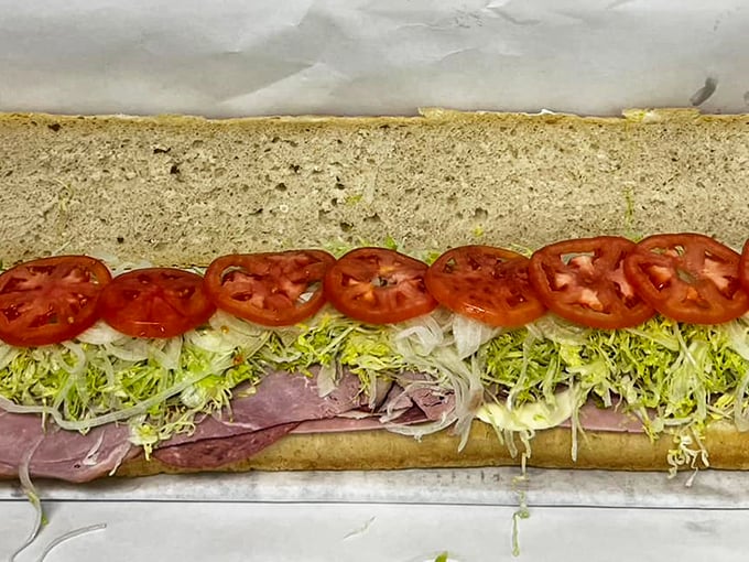 Layer upon layer of deli perfection! This Italian sub is stacked higher than a Jenga tower, but way more satisfying when it topples.