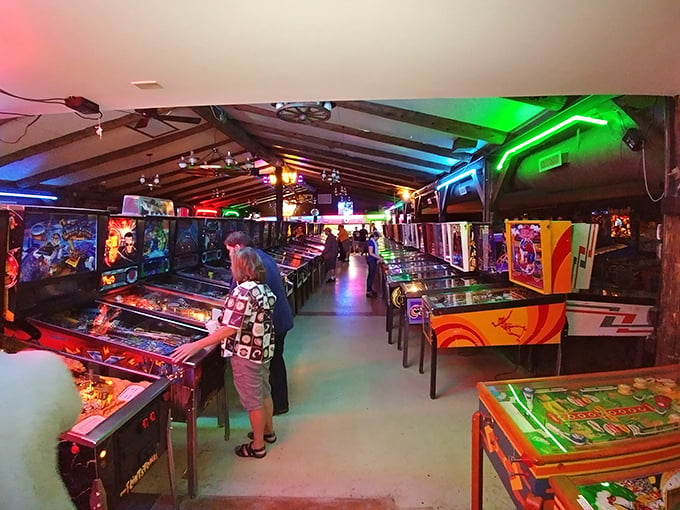 Watch as players of all ages become pinball wizards, their faces illuminated by the glow of their metallic dance partners.