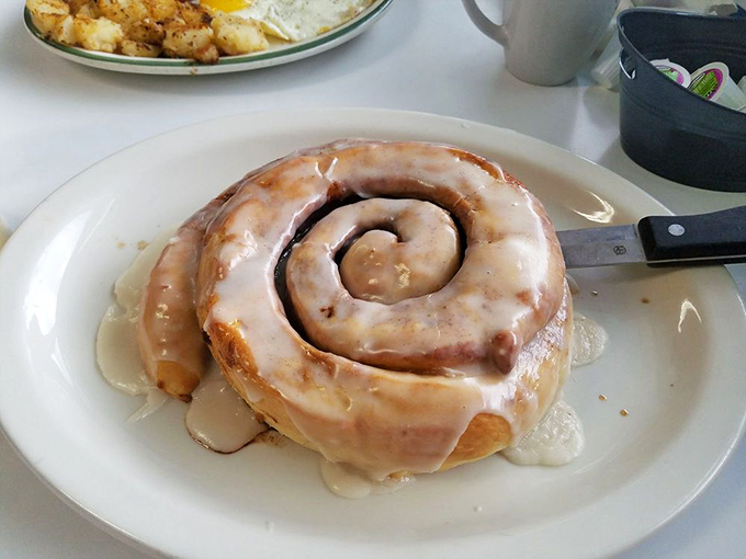 Holy cinnamon, Batman! This behemoth of a roll isn't just breakfast; it's a sweet, gooey adventure that'll have you planning your next visit.