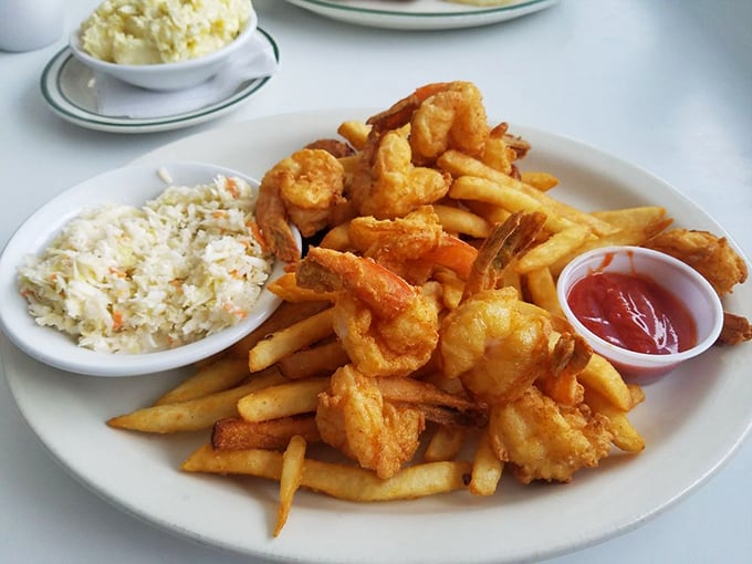 Seafood lovers, rejoice! This shrimp platter is so fresh, you might hear waves crashing. Don't forget to dive into that creamy coleslaw!