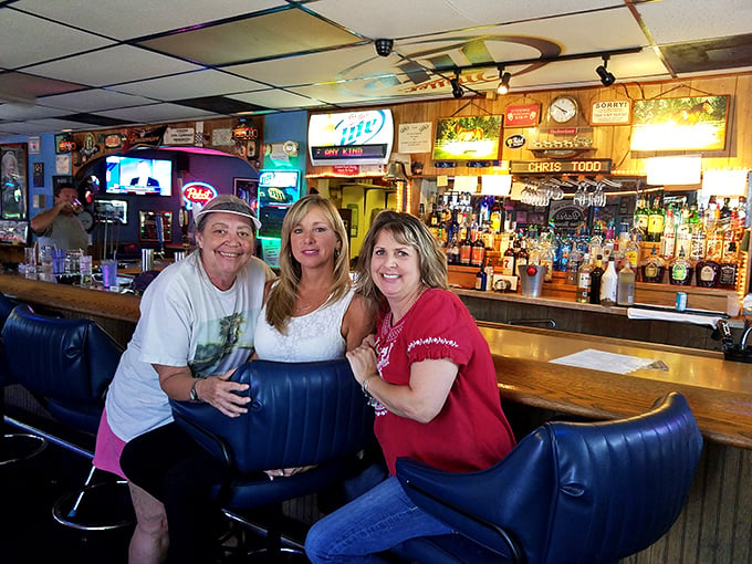 The gang's all here! Nothing says "local watering hole" quite like friends gathered at the bar, solving the world's problems one pint at a time.