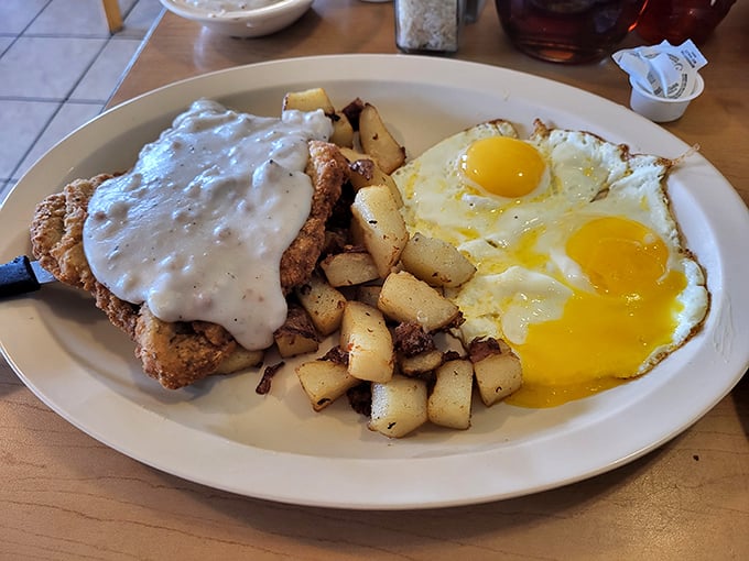 The holy trinity of breakfast: eggs, meat, and carbs. It's like a hug for your stomach, served sunny side up.