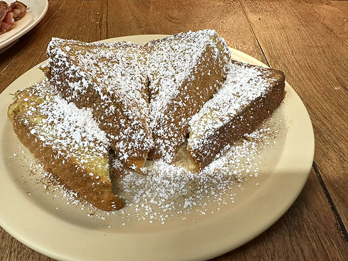 French toast that's more powdered than a Victorian lady's nose. It's breakfast masquerading as dessert, and we're not complaining!