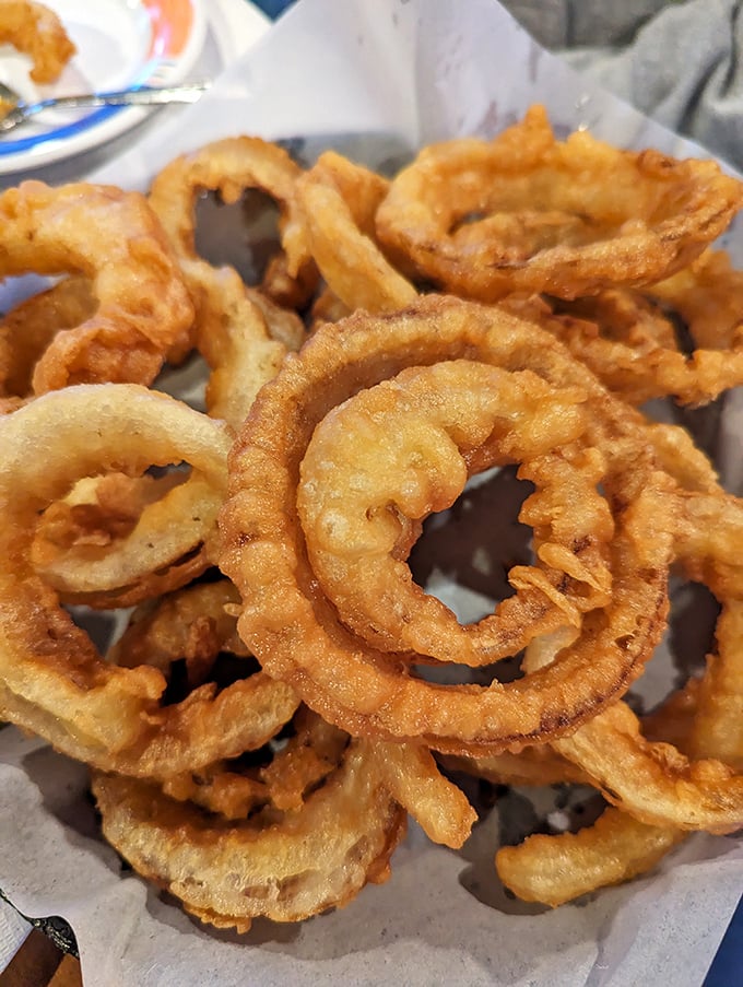 Golden rings of joy! These onion rings aren't just a side dish, they're edible jewelry for your taste buds. Crispy, crunchy perfection!