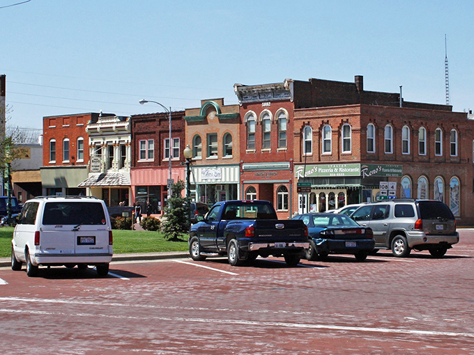 Main Street magic! These colorful storefronts aren't just pretty faces – they're the beating heart of Carlinville, each with stories as rich as grandma's secret recipe.