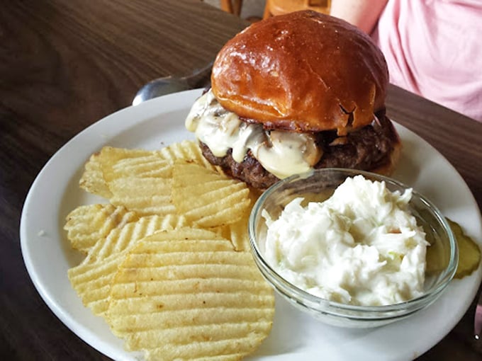 Burger lovers, meet your match! This beefy behemoth comes with a side of crispy chips and a dollop of pure joy.