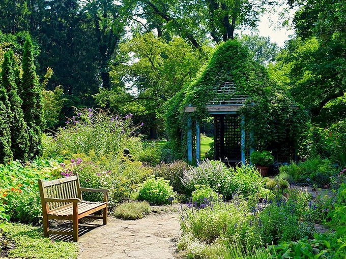 Bench-warmers welcome! This cozy nook invites visitors to pause and soak in the beauty, proving that sometimes, the best gardening is done sitting down.