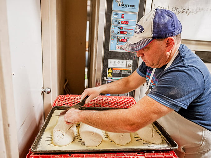 La Panciata's bread whisperer at work. Watch in awe as dough transforms into edible art. It's culinary alchemy!