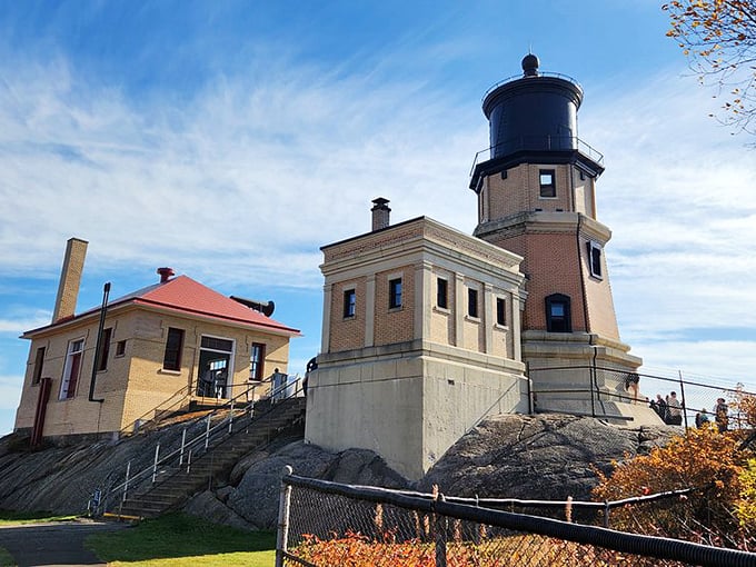 Brick by brick, this lighthouse tells a tale. Its sturdy frame has weathered more storms than a soap opera character's love life.