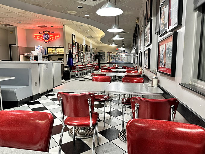 Step into a time warp of taste! The retro-chic interior, with its cherry-red seats and checkered floors, sets the stage for culinary nostalgia.