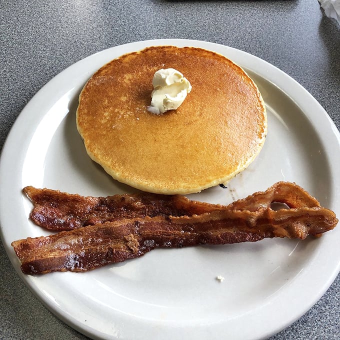 Pancakes and bacon: the dynamic duo of breakfast. Golden, fluffy, and ready to soak up maple syrup like a delicious sponge.