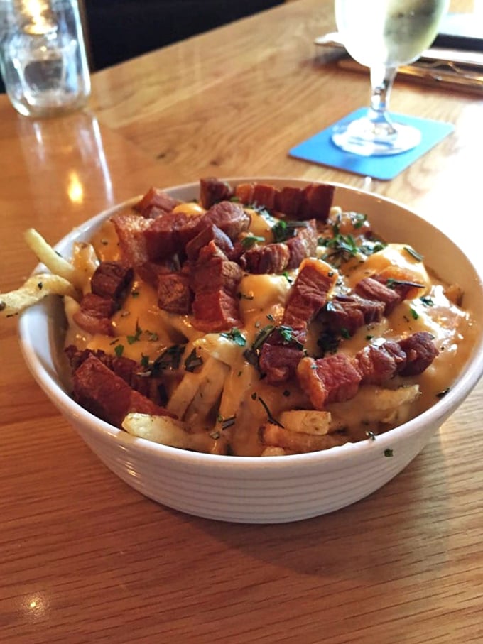 Pork belly poutine: where comfort food gets a gourmet makeover. It's like your childhood favorite grew up, got fancy, and came back to sweep you off your feet.