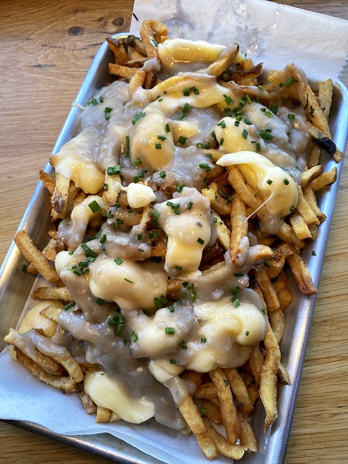 Behold, the poutine that launched a thousand food cravings! Golden fries, squeaky cheese curds, and gravy that could make a vegetarian weep with temptation.