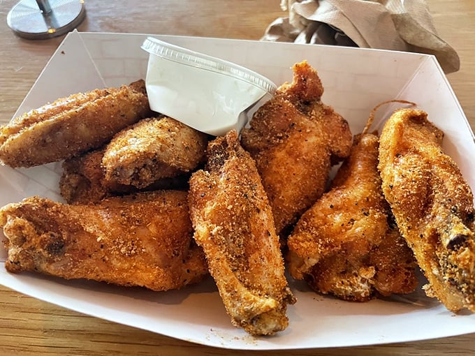 Wings that'll make you want to flap your own! These crispy, dry-rubbed delights are proof that sometimes, the simplest pleasures are the most satisfying.